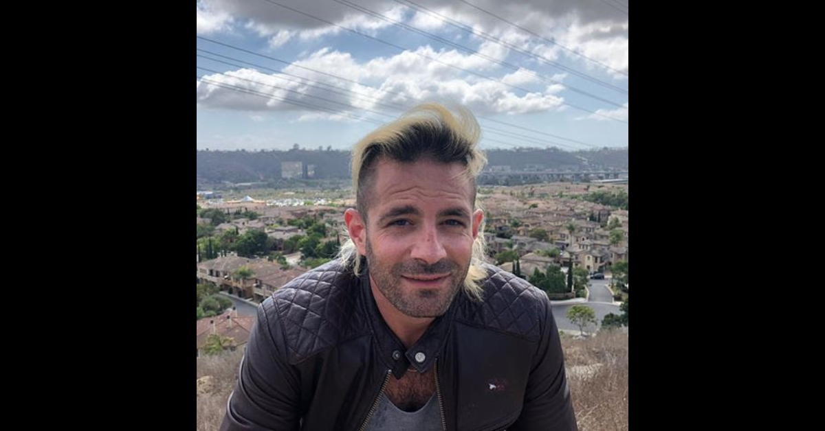 Eddie Signaigo on a hill with bleached hair.