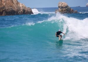 Eddie Signaigo surfing.