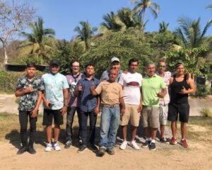 Eddie Signaigo with some of the local surfers in Bahía Santiago, Manzanillo.