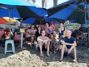 Eddie Signaigo and friends on the beach at the Reyes de Verano surf competition.