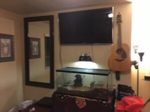 Eddie's Yamaha Acoustic Guitar Hanging on the Wall in his apartment.