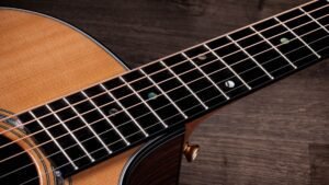 Taylor Guitar with peg for shoulder strap.