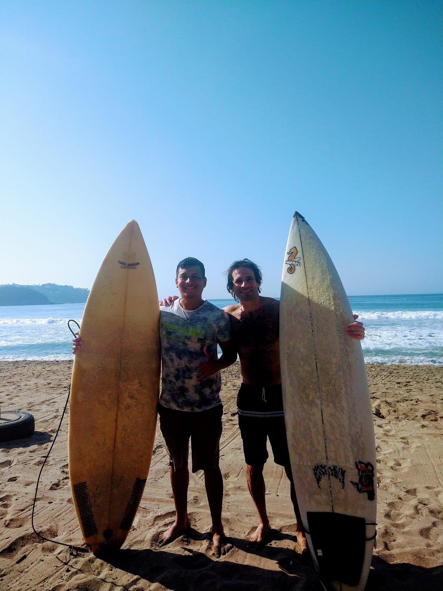 Eddie and Miguel with surfboards