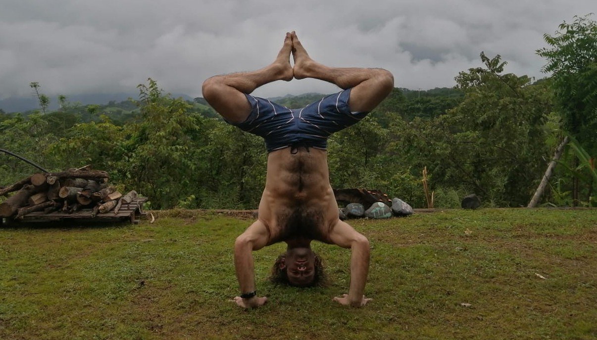 Eddie Signaigo doing a headstand in the jungle in Mexico.